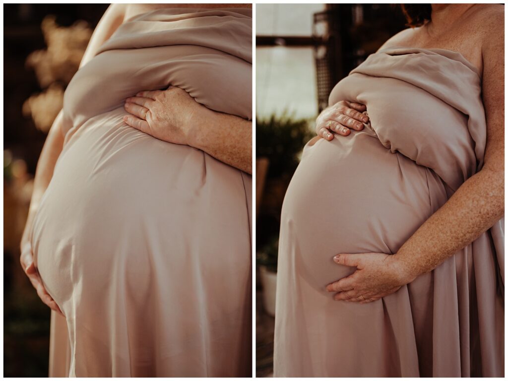 close up portrait of a womans pregnant belly draped in fabric