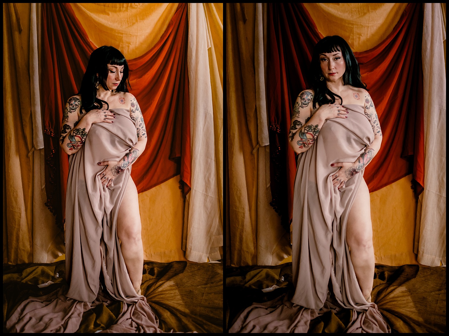 A woman with tattoos stands against a backdrop of draped brown and gold fabric. Her long, dark hair has a wet look, and she covers herself with a beige cloth, posing confidently. The lighting creates a warm and intimate atmosphere reminiscent of classical art.