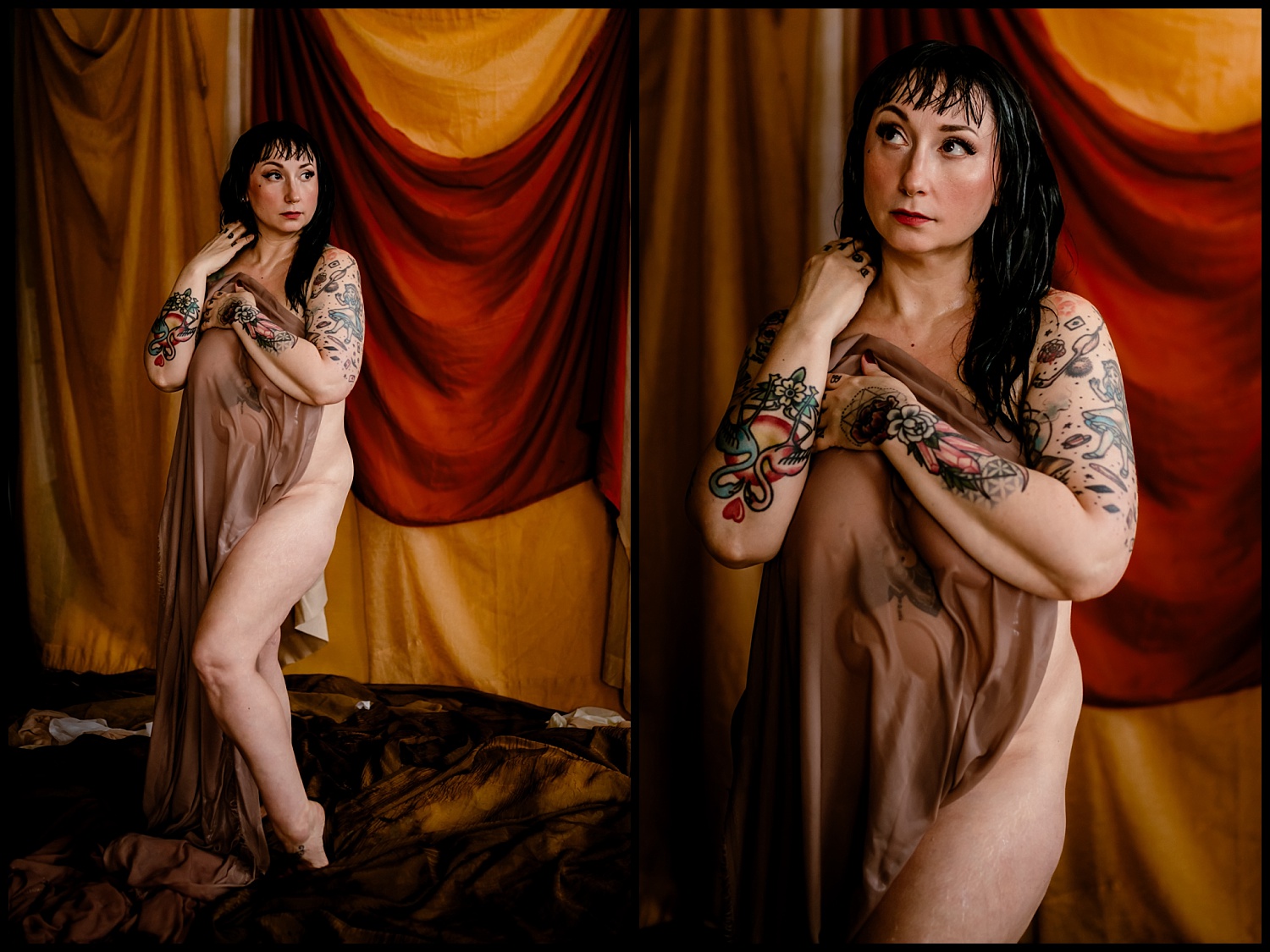 Person with tattoos poses draped in a translucent fabric in front of a backdrop with red and yellow drapes. The setting, enhanced by warm lighting, creates an artistic, intimate atmosphere with a touch of classical elegance and wet look allure.