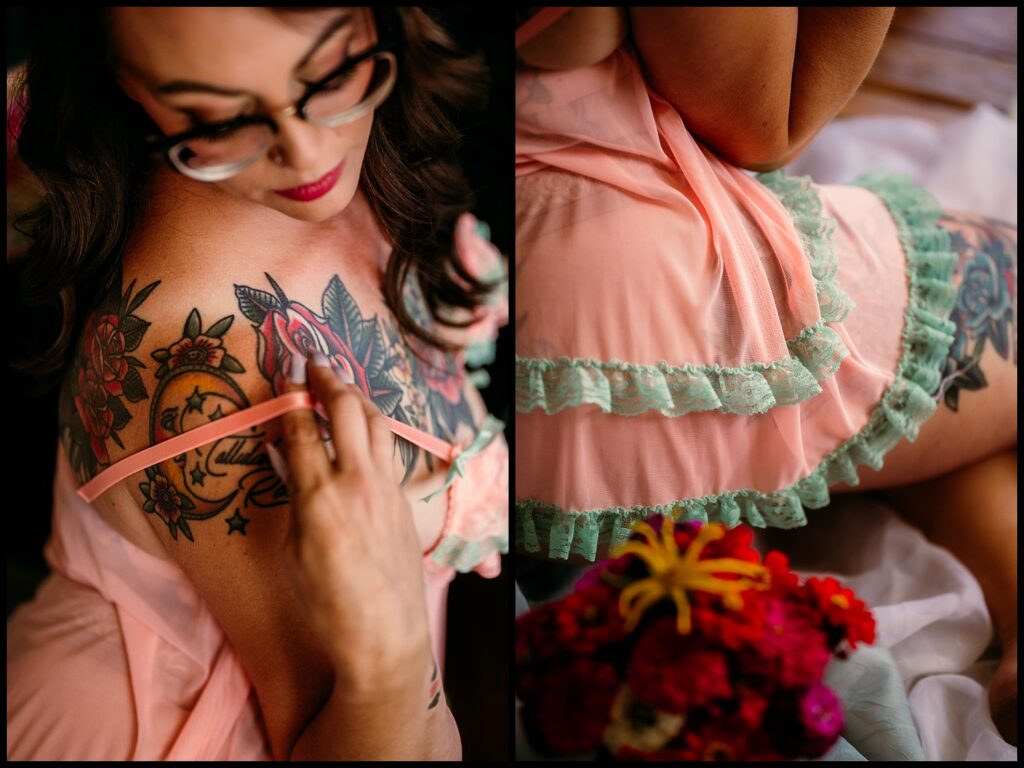 Split image: Left, a woman with glasses lowers a pink strap on her tattooed shoulder. Right, close-up of her lacy pink and green nightgown and hip tattoo, with red flowers in the foreground—captured in a Nashville Studio Birthday Boudoir Session.