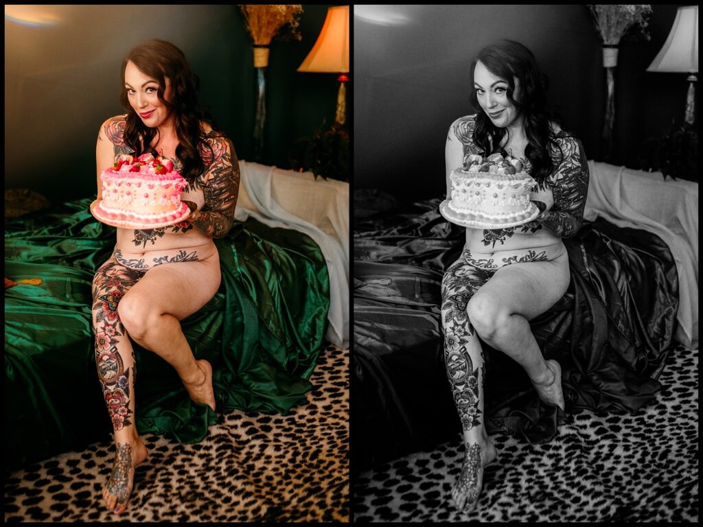 A woman with tattoos on her body holds a cake during a vibrant Birthday Boudoir Session at a Nashville Studio.