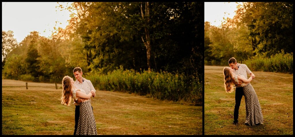 During their Nashville engagement session, a man in a white shirt dips a woman in a checkered dress while dancing on a grassy field at golden hour, surrounded by green trees and warm sunset light.