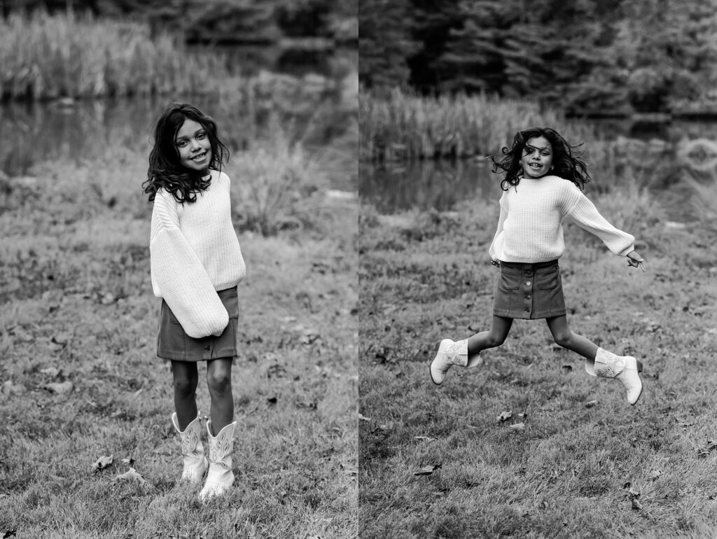 Black and white photo of a young girl outdoors from a fall family session. On the left, she smiles; on the right, she jumps in a sweater, skirt, and cowboy boots, with blurred pond and trees—a timeless Nashville portrait photographer capture.