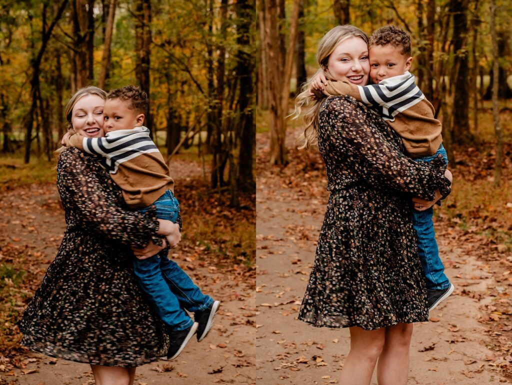 A woman in a floral dress holds a young boy on a leaf-strewn path in the woods during a fall family session. In one photo, she spins with him; in the other, they smile together—captured by a Nashville portrait photographer.