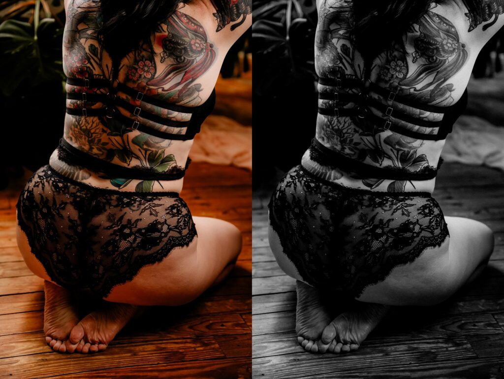 A person with floral tattoos on their back and wearing black lace lingerie sits on a wooden floor, viewed from behind. The image, a striking example of Nashville Boudoir Photography, is split between color and black and white.