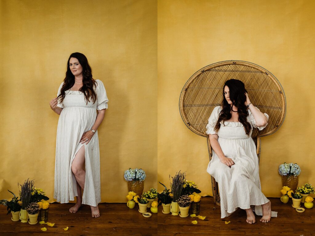 A woman in a white dress poses barefoot before a yellow background, standing and sitting on a wicker chair, surrounded by yellow pots, vases, and blue and yellow flowers—an image styled by a Nashville creative portrait photographer.