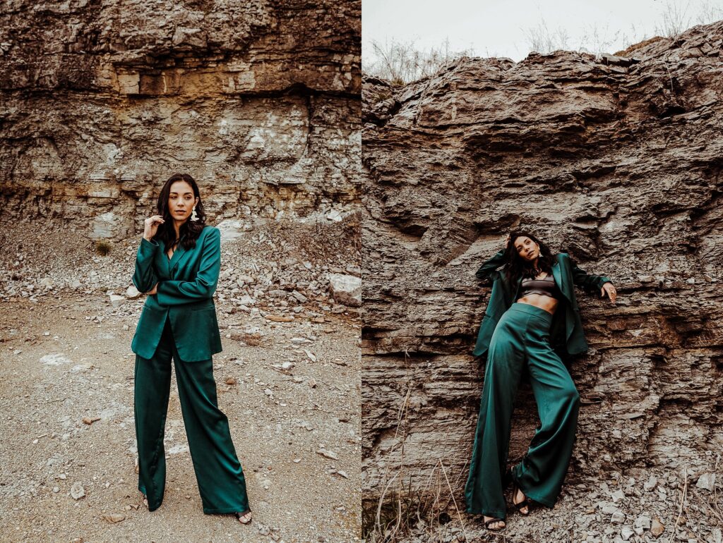A woman in a shiny green suit poses confidently in front of rocky cliffs, captured by a Nashville creative portrait photographer. On the left, she stands with one hand to her chin; on the right, she leans back with her suit jacket open.