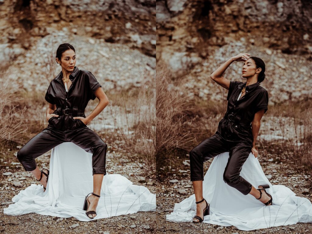 A woman in a black jumpsuit and heels poses outdoors on a white-draped stool, surrounded by rocky terrain and dry grass, striking two confident poses—captured by a Nashville creative portrait photographer.