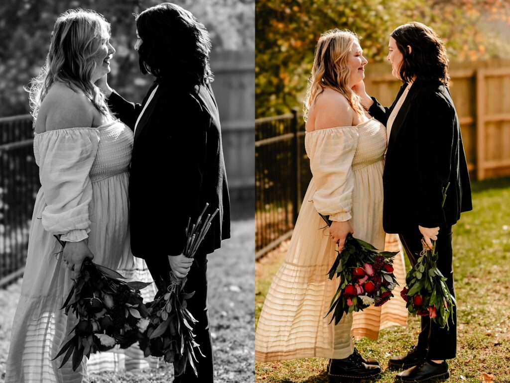Two women stand facing each other outdoors, smiling and holding bouquets of red roses. Captured by a Nashville wedding photographer, the left side is in black and white, while the right side is in color. They appear happy and affectionate.
