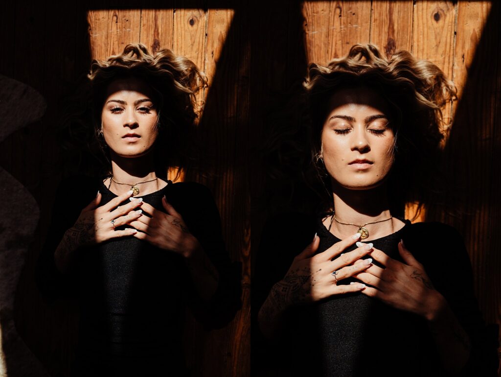 A woman with closed eyes lies on a wooden floor in sunlight, her hands resting on her chest. The light creates strong shadows, and her wavy hair fans out around her head—an artistic scene by a Nashville creative portrait photographer. The image appears duplicated side by side.
