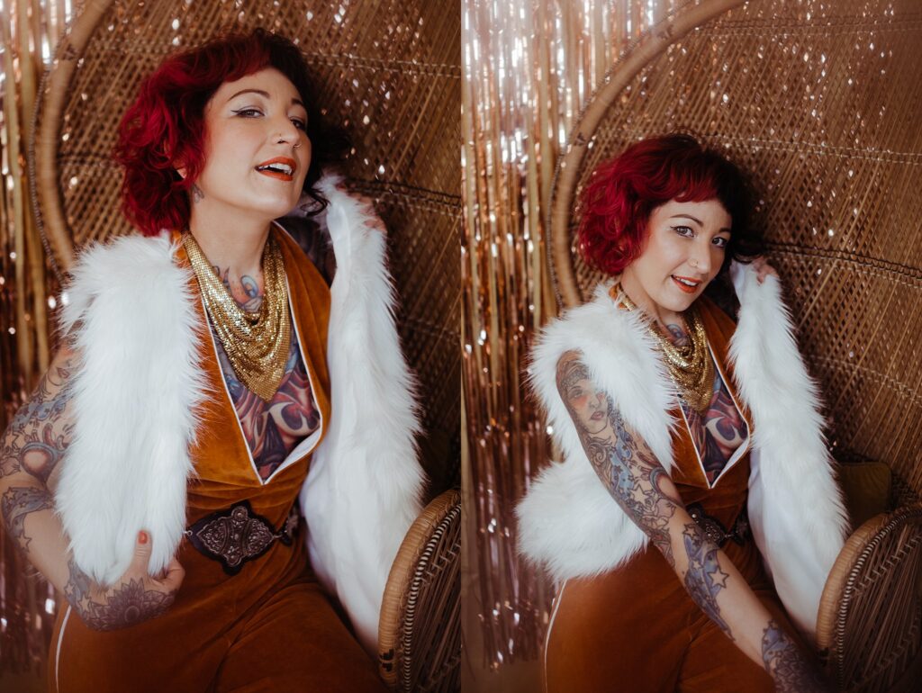 A woman with red hair, tattoos, and a white fur vest over a rust-colored outfit sits on a wicker chair, smiling in both images. Captured by a Nashville creative portrait photographer, she is framed by sparkling gold sequin-like background curtains.